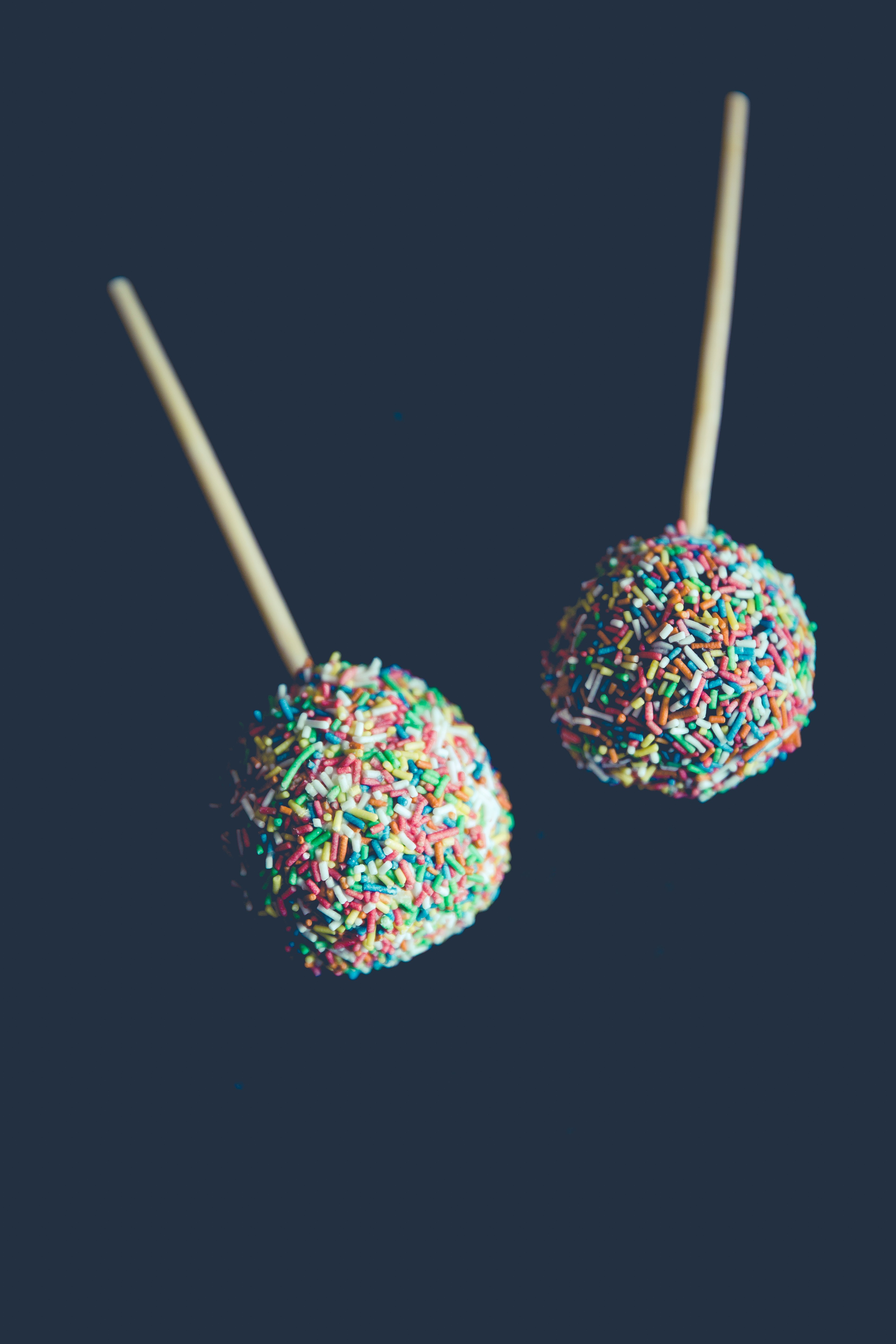 two sprinkled lollipops
